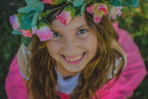 girl smiling with flower crown on head